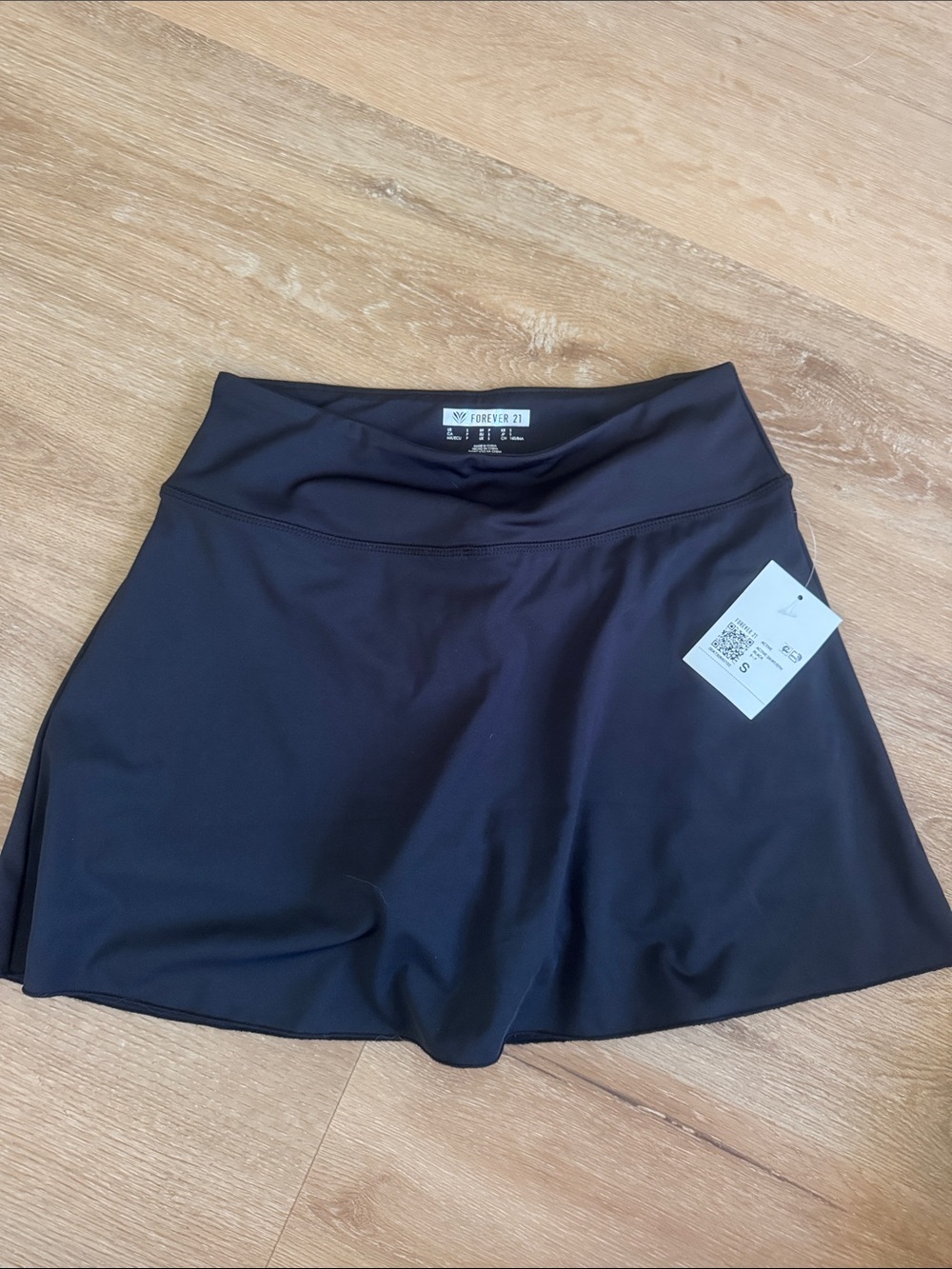 NWT forever 21 black skirt with biker shorts underneath. Size small.